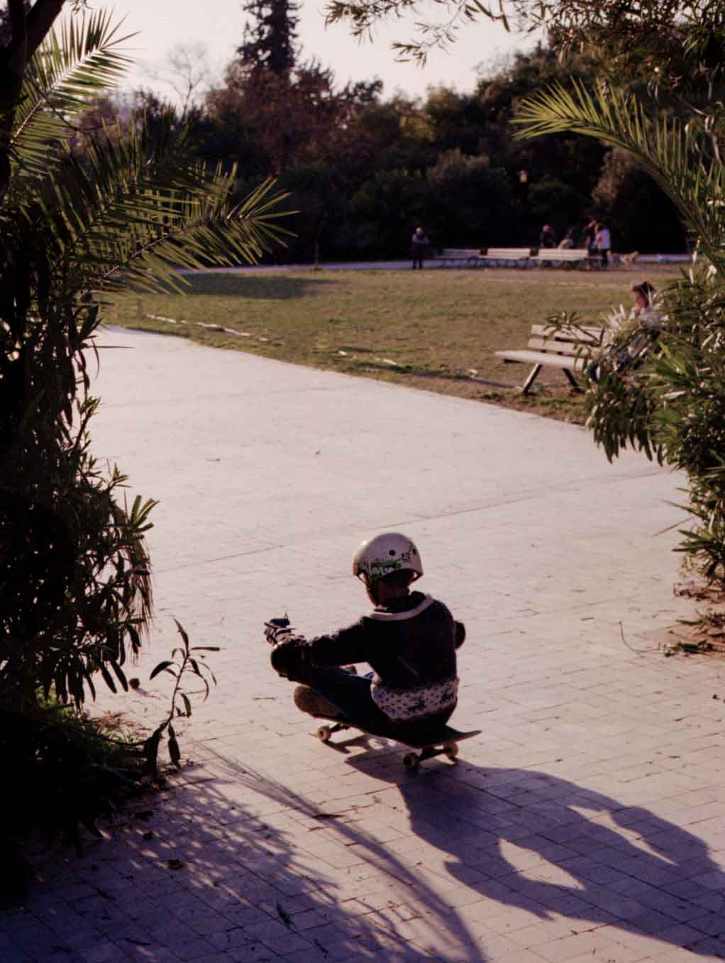 a refugee child on a skateboard