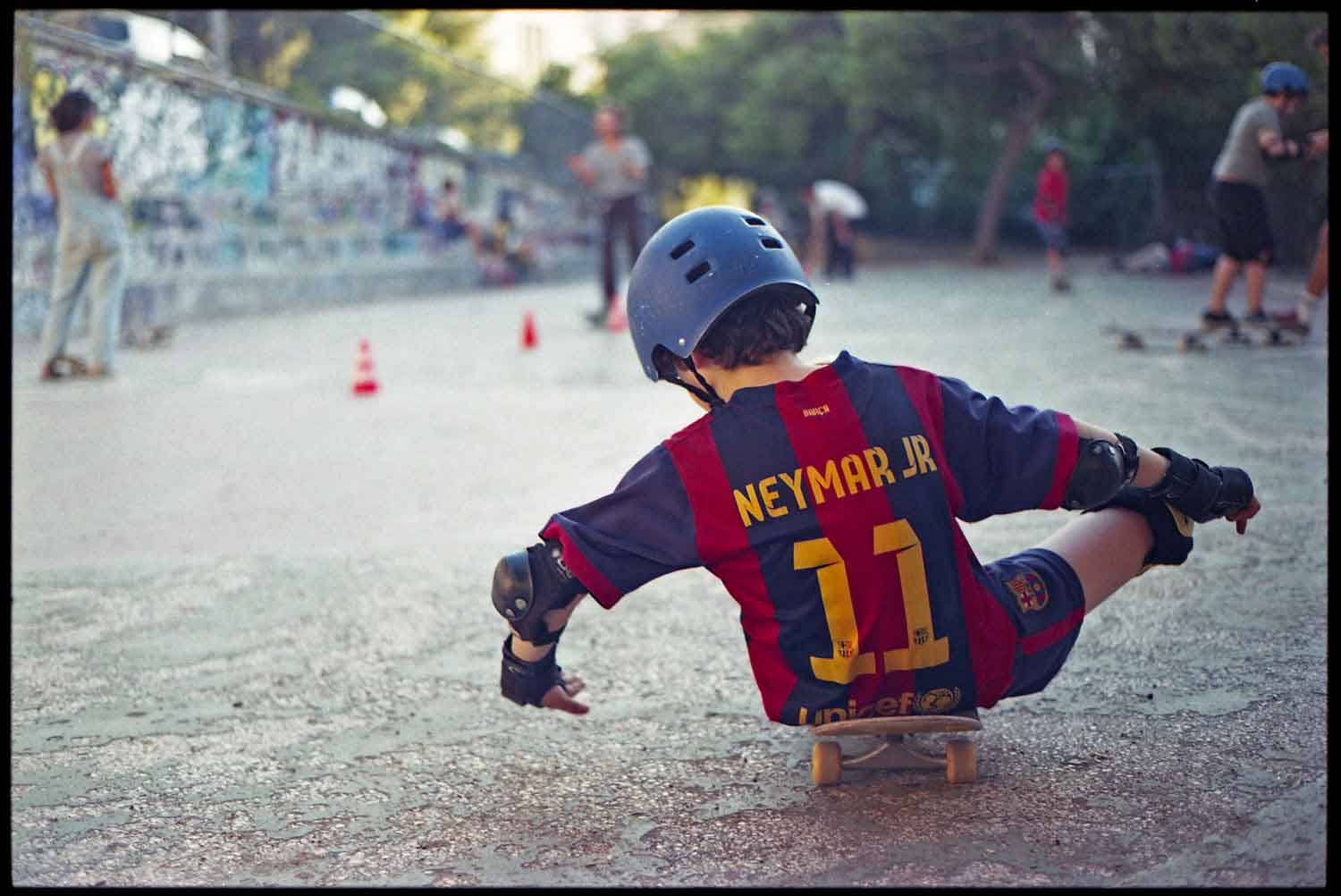 refugee child on a skateboard